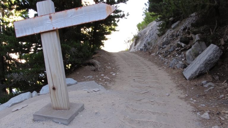 arrow indicates trail direction